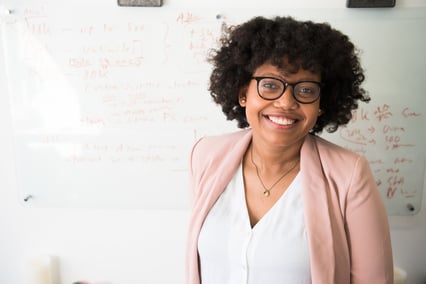 Tutor standing in front of a whiteboard